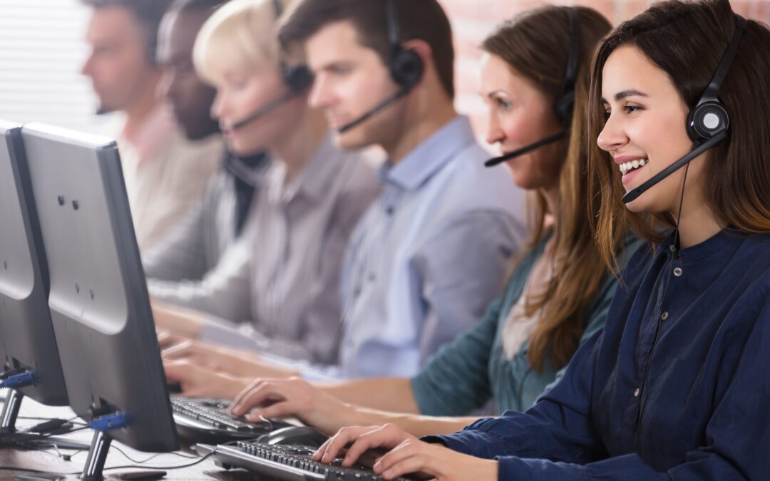 Contact Centre agents on headphones talking to clients