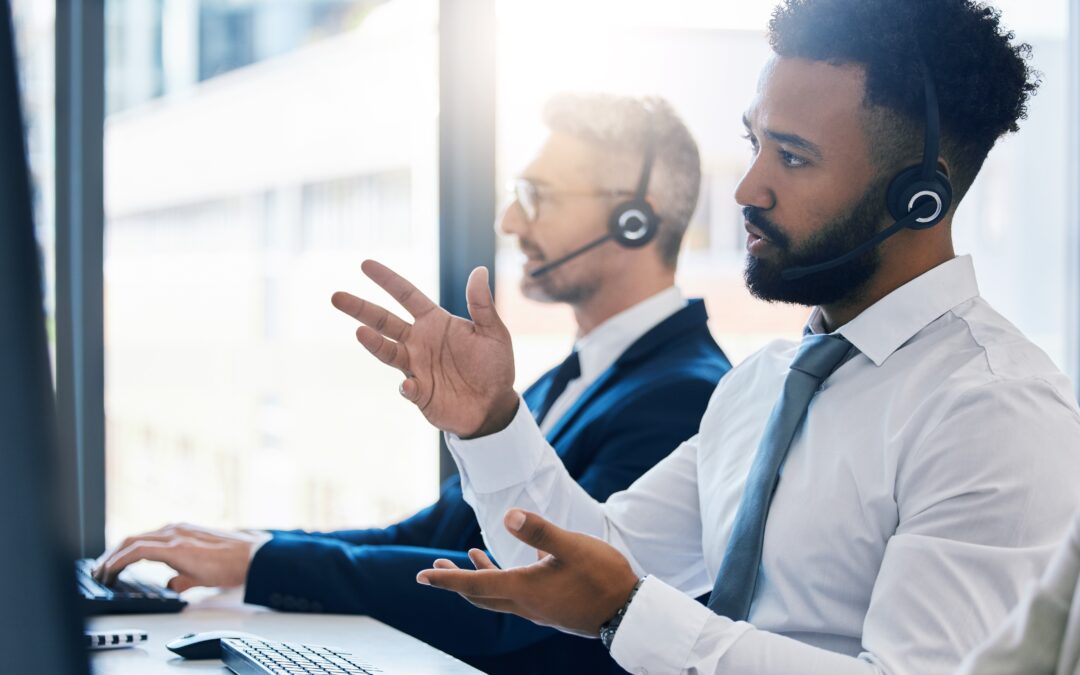 Contact Centre agents on headphones talking to clients