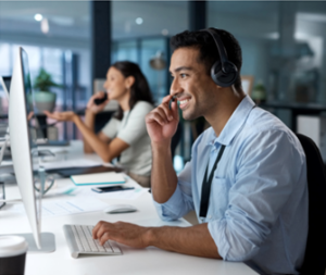 Contact centre staff member speaking on headphone